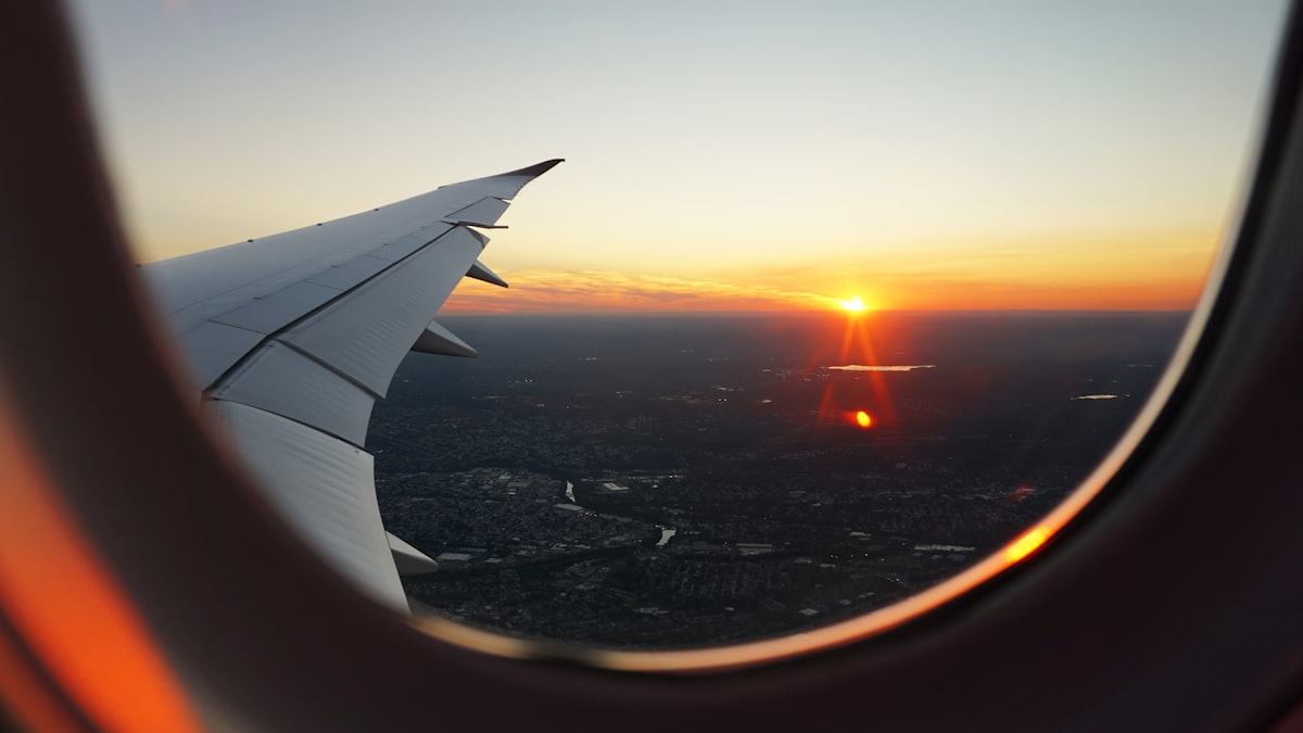 View from airplane window at sunset